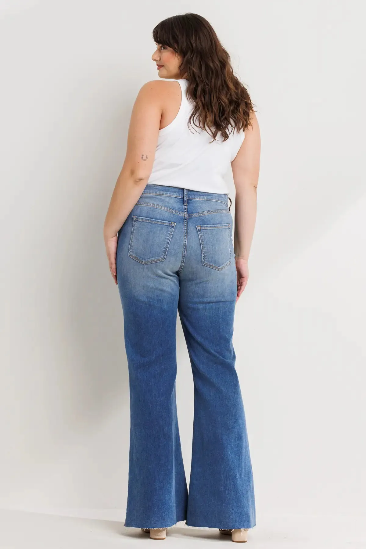 PLUS HIGH RISE DISTRESSED MEDIUM DENIM FLARES WITH RAW HEM