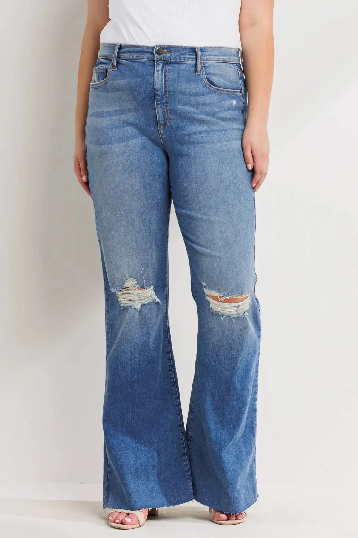 PLUS HIGH RISE DISTRESSED MEDIUM DENIM FLARES WITH RAW HEM